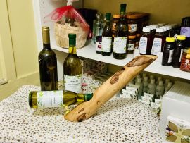 Handmade Greek Olive Wood Wine Bottle Holder — lifestyle view
